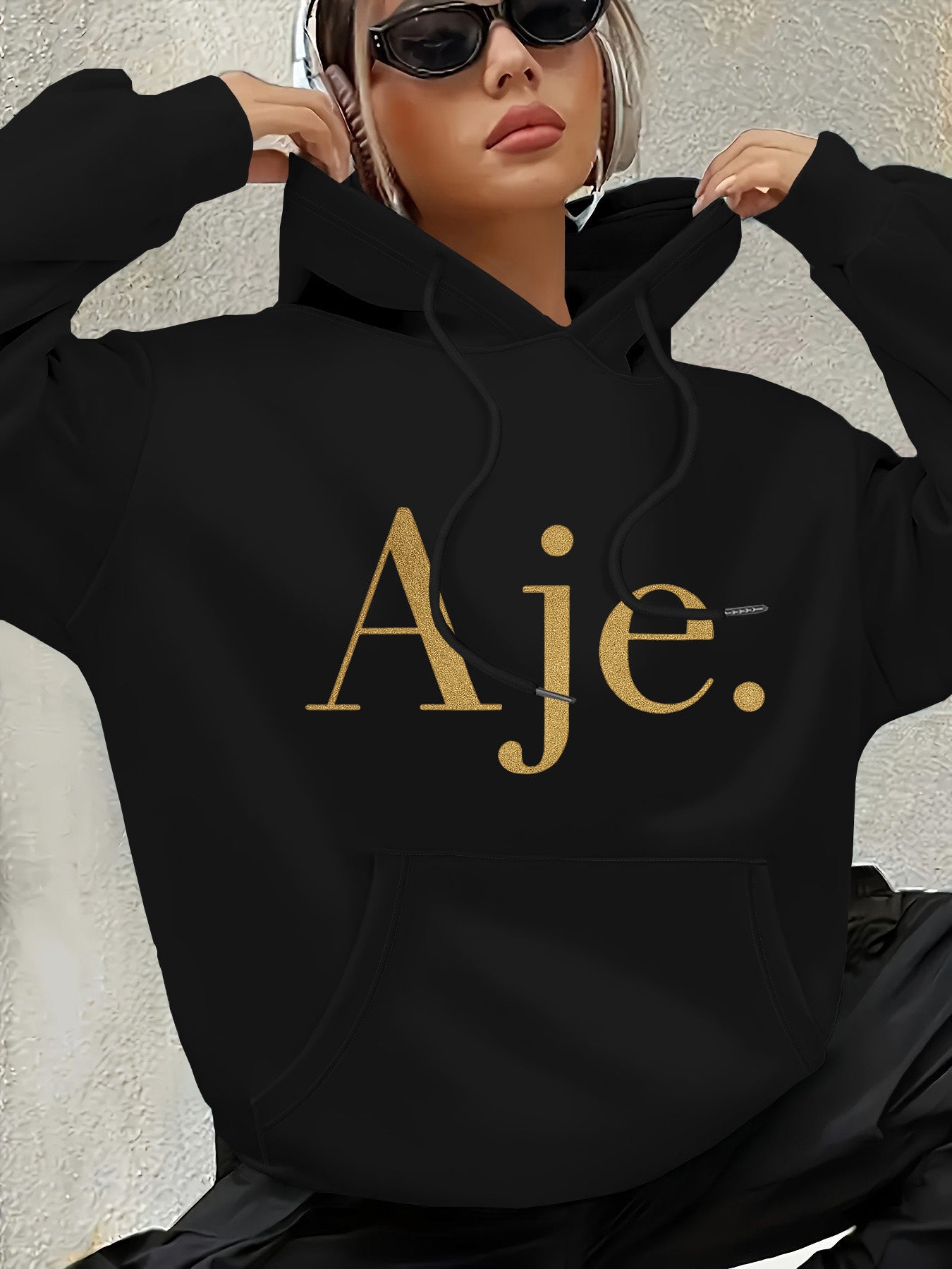 Aje Women's Fleece-Lined Hooded Sweatshirt - Golden Foil Lettering Print, Cozy Casual Pullover for Fall/Winter, Machine Washable, Cute Sweatshirts, Winter Outfit, Relaxed Fit, Comfortable Material, Printed Hoodie, Streetwear Lovers, Fall Fashion, Trendy H