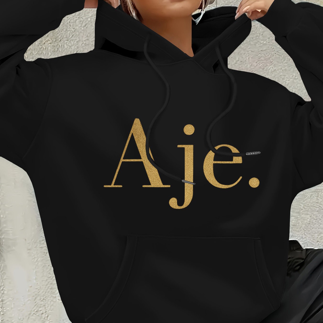 Aje Women's Fleece-Lined Hooded Sweatshirt - Golden Foil Lettering Print, Cozy Casual Pullover for Fall/Winter, Machine Washable, Cute Sweatshirts, Winter Outfit, Relaxed Fit, Comfortable Material, Printed Hoodie, Streetwear Lovers, Fall Fashion, Trendy H