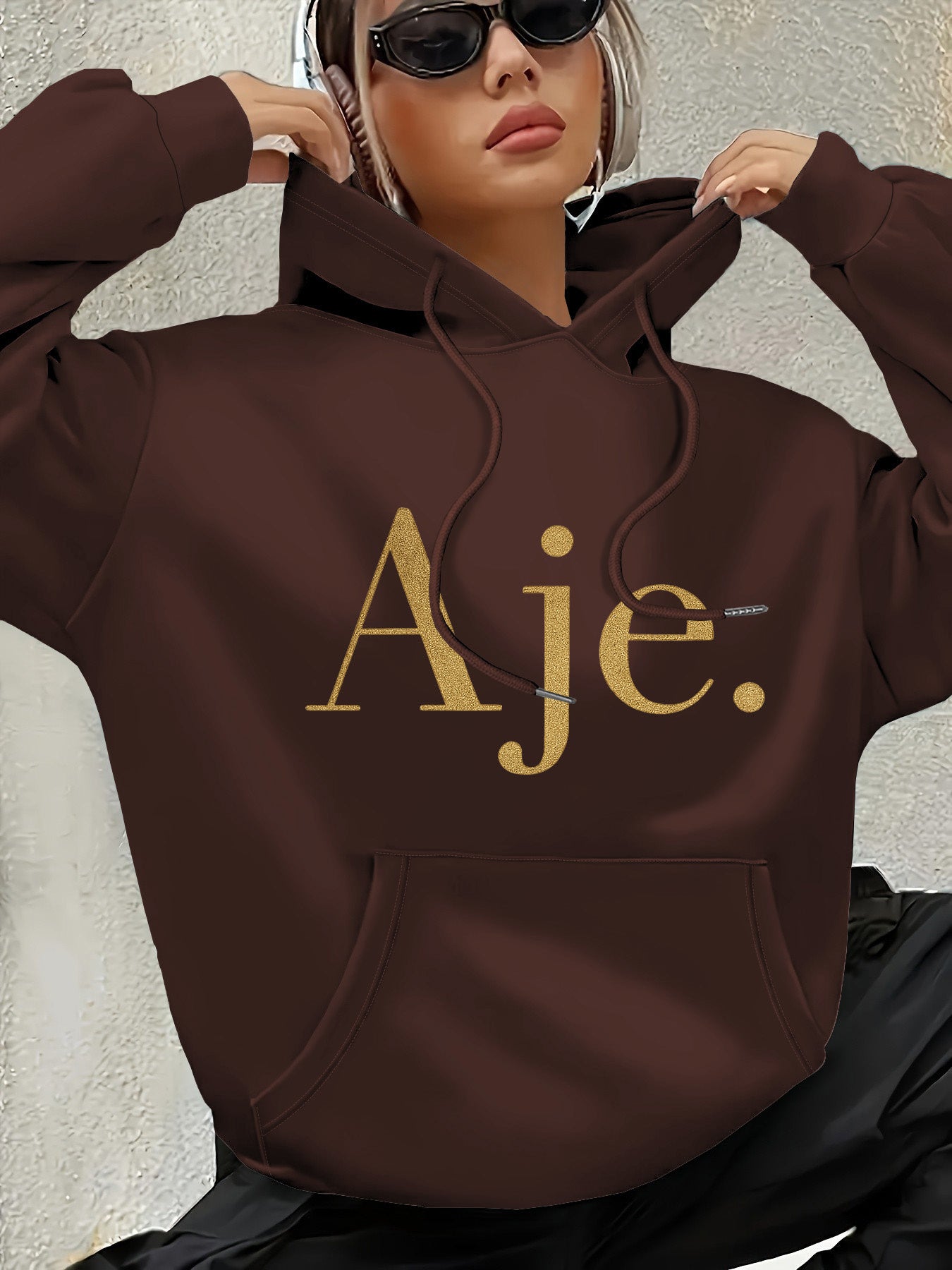 Aje Women's Fleece-Lined Hooded Sweatshirt - Golden Foil Lettering Print, Cozy Casual Pullover for Fall/Winter, Machine Washable, Cute Sweatshirts, Winter Outfit, Relaxed Fit, Comfortable Material, Printed Hoodie, Streetwear Lovers, Fall Fashion, Trendy H